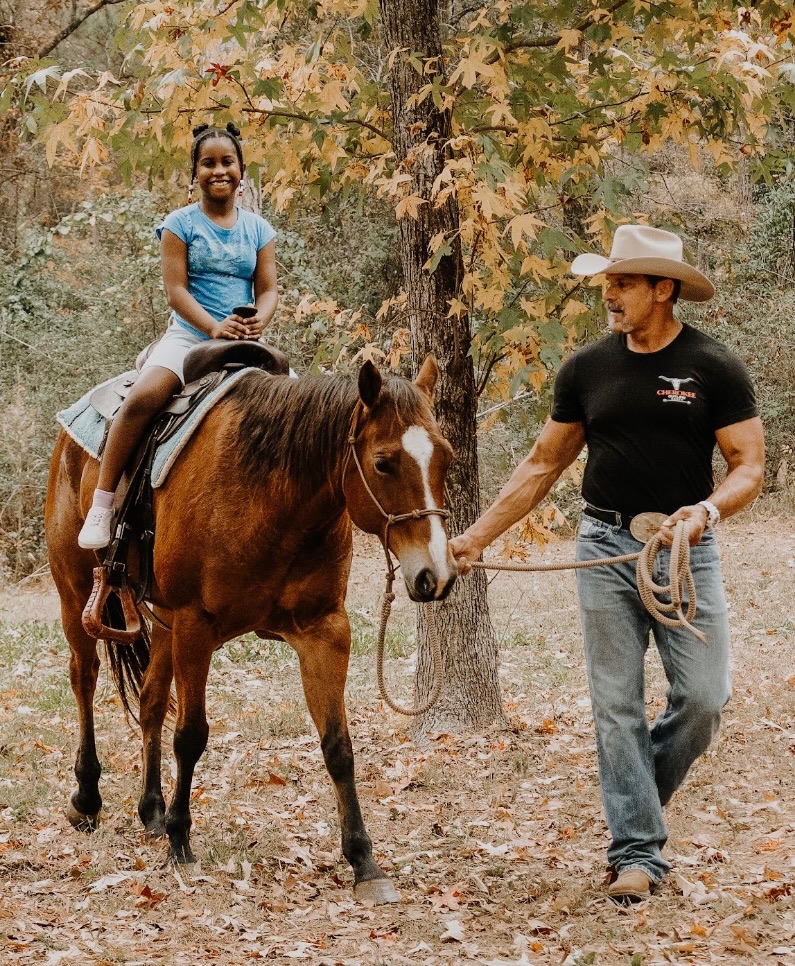 Ty walking child on horse